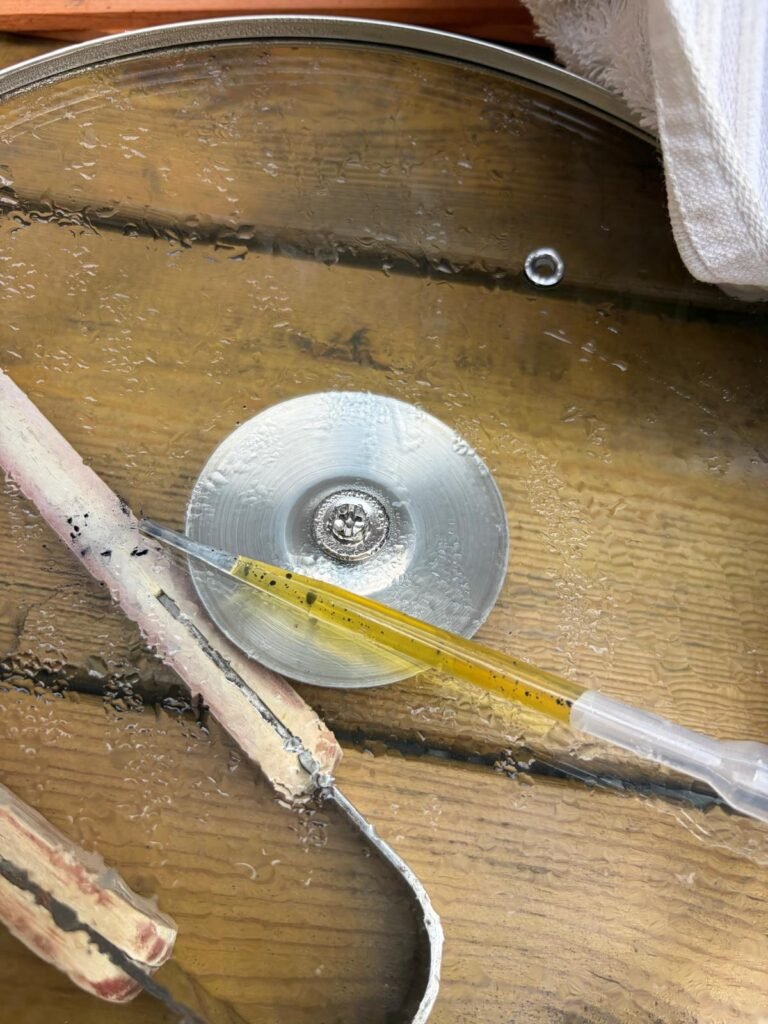 Reduced indigo vat liquid showing its yellow colour
