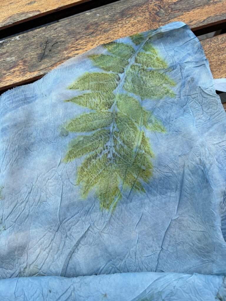 Botanical leaf print on indigo dyed ponge silk